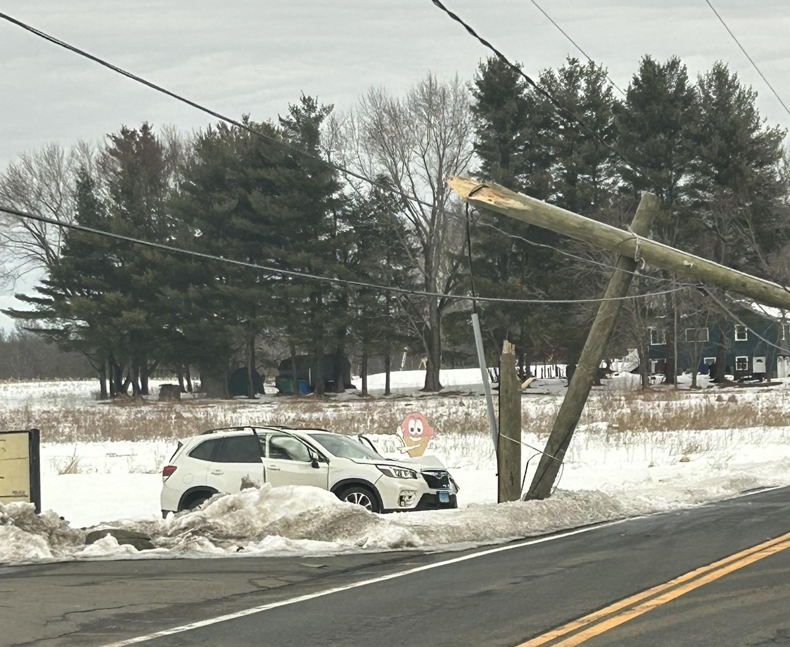 Officials: Ellington road closed after car crashes into utility pole