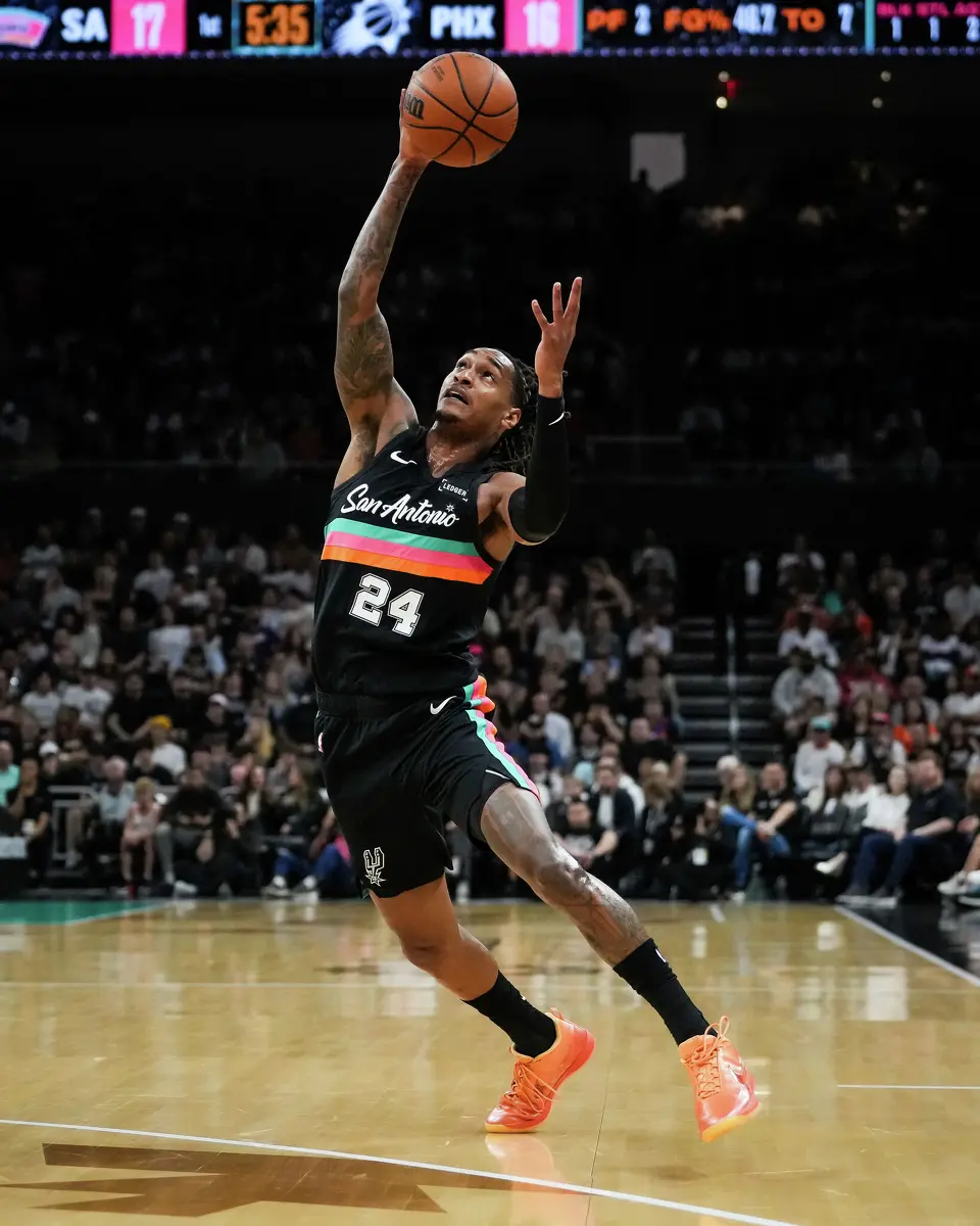 San Antonio Spurs guard Devin Vassell (24) catches a high pass in the first quarter as the Spurs take on the Suns on Thursday night, Feb. 19, 2026 in the first of two “I-35 Series” games in Austin at the Moody Center.