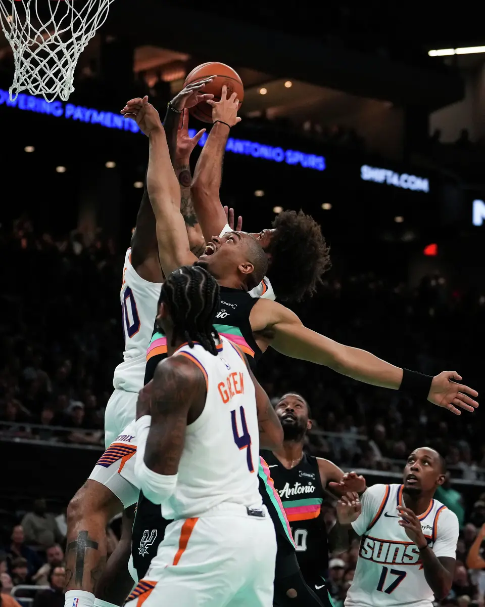 San Antonio Spurs guard Keldon Johnson (3) battles for the rebound in the second quarter as the Spurs take on the Suns on Thursday night, Feb. 19, 2026 in the first of two “I-35 Series” games in Austin at the Moody Center.
