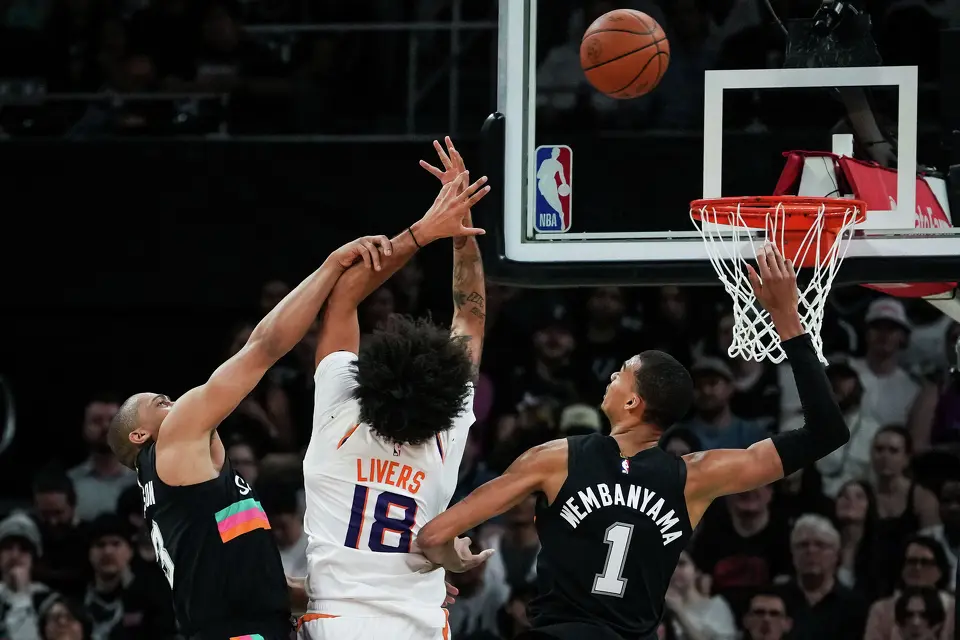 San Antonio Spurs guard Keldon Johnson (3) and forward Victor Wembanyama (1) defend against Phoenix Suns forward Isaiah Livers (18) in the second quarter as the Spurs take on the Suns on Thursday night, Feb. 19, 2026 in the first of two “I-35 Series” games in Austin at the Moody Center.