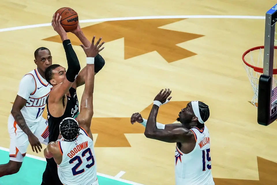 San Antonio Spurs forward/center Victor Wembanyama (1) drives to the hoop as Phoenix Suns guard Jordan Goodwin (23) defends in the third quarter as the Spurs take on the Suns on Thursday night, Feb. 19, 2026 in the first of two “I-35 Series” games in Austin at the Moody Center. The Spurs won the game 121-94.