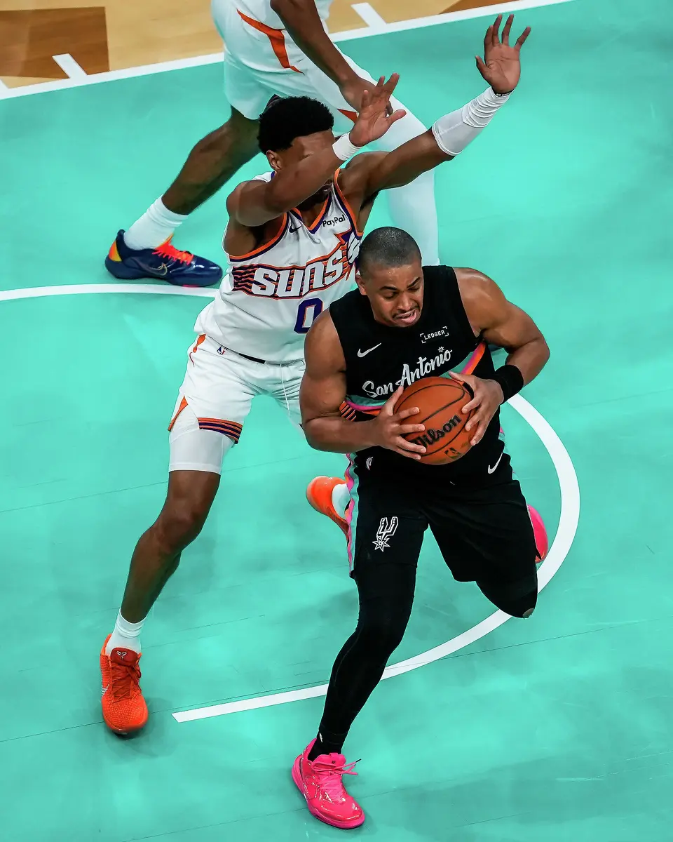 San Antonio Spurs forward/guard Keldon Johnson (3) wins the defensive rebound in the third quarter as the Spurs take on the Suns on Thursday night, Feb. 19, 2026 in the first of two “I-35 Series” games in Austin at the Moody Center. The Spurs won the game 121-94.