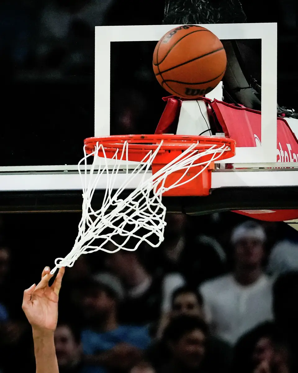 San Antonio Spurs forward Victor Wembanyama (1) catches his hand in the net in the fourth quarter as the Spurs take on the Suns on Thursday night, Feb. 19, 2026 in the first of two “I-35 Series” games in Austin at the Moody Center. The Spurs won the game 121-94.