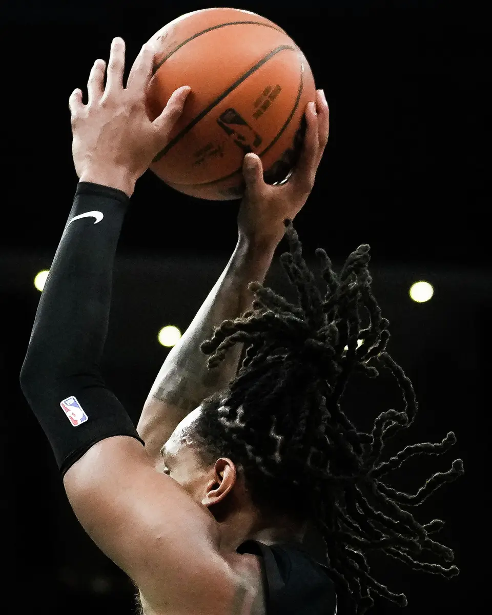San Antonio Spurs guard/forward Devin Vassell (24) shoots for three points in the first quarter as the Spurs take on the Suns on Thursday night, Feb. 19, 2026 in the first of two “I-35 Series” games in Austin at the Moody Center. The Spurs won the game 121-94.