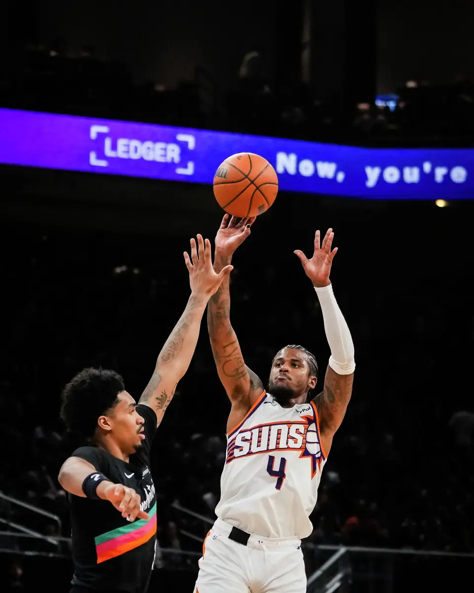Phoenix Suns guard Jalen Green (4) shoots over San Antonio Spurs guard Dylan Harper (2) in the fourth quarter as the Spurs take on the Suns on Thursday night, Feb. 19, 2026 in the first of two “I-35 Series” games in Austin at the Moody Center. The Spurs won the game 121-94.