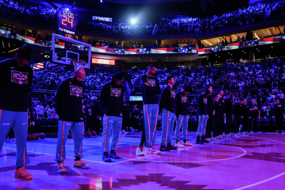 The San Antonio Spurs stand on the court during the National Anthem ahead of the Spurs’ game against the Phoenix Suns on Thursday night, Feb. 19, 2026, the first of two “I-35 Series” games in Austin at the Moody Center. The Spurs won the game 121-94.
