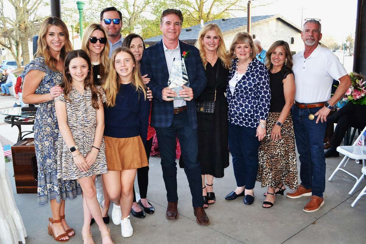 Todd Bartholet, 62, center, owner of Bartholet Home Furnishings in Conroe was named the 2026 Conroe Founders Day Citizen of the Year Thursday evening at the annual Conroe Founders Day event celebrating the city namesake Isaac Conroe.