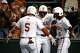 Texas Longhorns infielder Adrian Rodriguez (24) and outfielder Anthony Pack Jr. (6) celebrate a home run by infielder Ethan Mendoza (5) during the game against Michigan State at UFCU Disch-Falk Field on Friday, Feb. 20, 2026 in Austin.