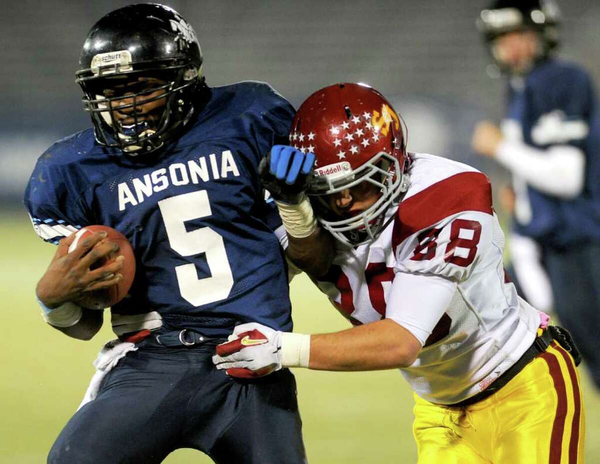 Ansonia's Montrell Dobbs carries the ball during Saturday's Class S State Football Championship game at Rentschler Field in East Hartford on December 11, 2010.