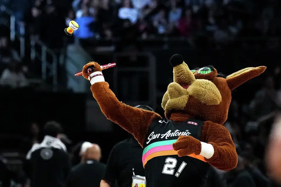 The Coyote hits rubber ducks into the crowd during the San Antonio Spurs game against the Sacramento Kings at the Moody Center on Saturday, Feb. 21, 2026 in Austin.
