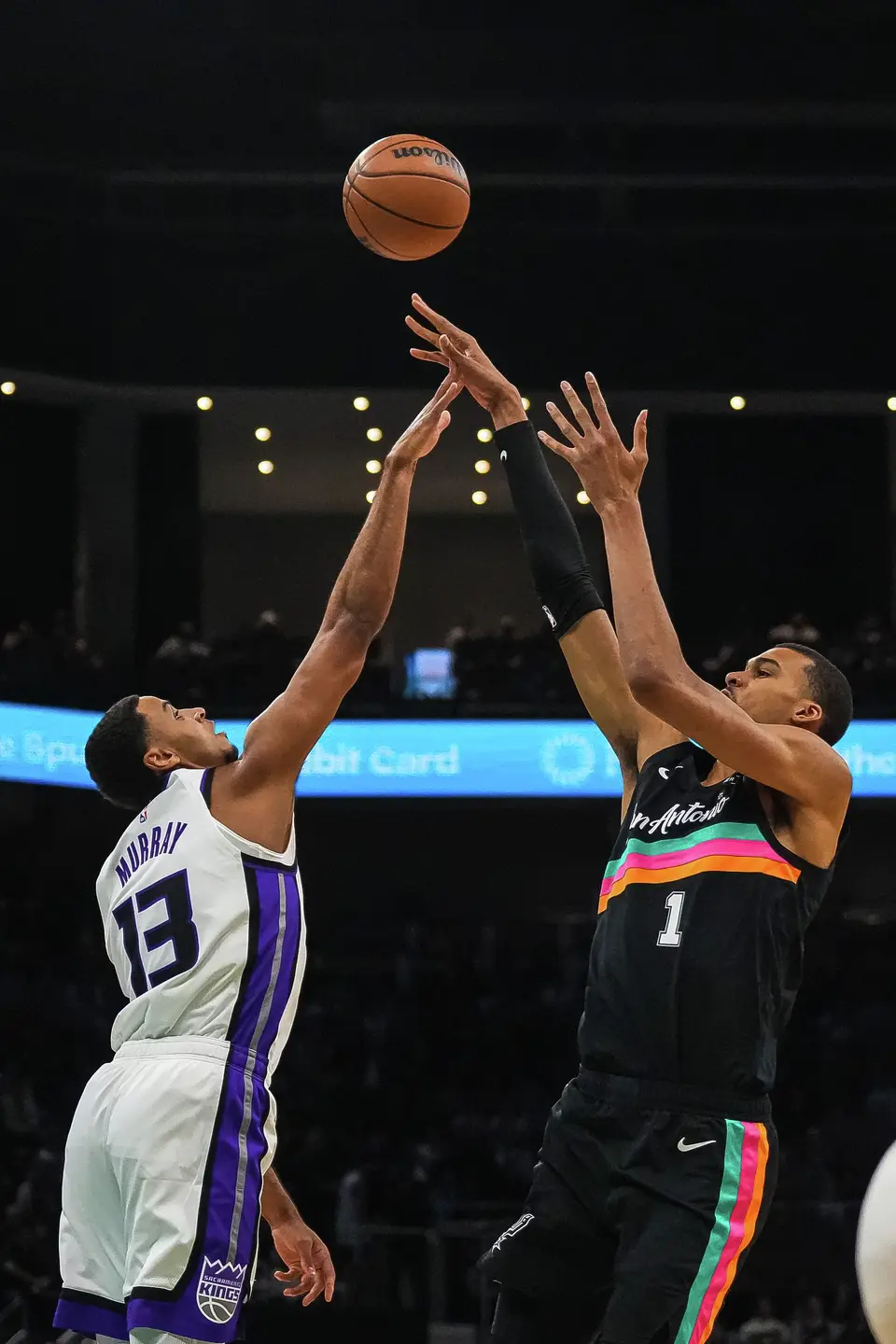 San Antonio Spurs forward Victor Wembanyama (1) shoots the ball over Sacramento Kings forward Keegan Murray (13) during the game at the Moody Center on Saturday, Feb. 21, 2026 in Austin.