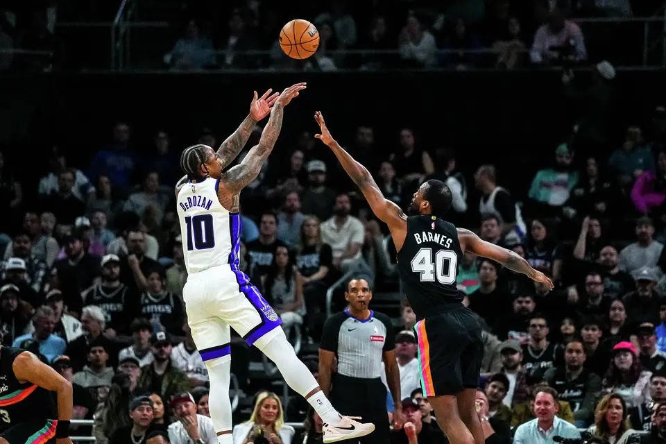 Sacramento Kings guard DeMar DeRozan (10) shoots the ball over San Antonio Spurs forward Harrison Barnes (40) during the game at the Moody Center on Saturday, Feb. 21, 2026 in Austin.