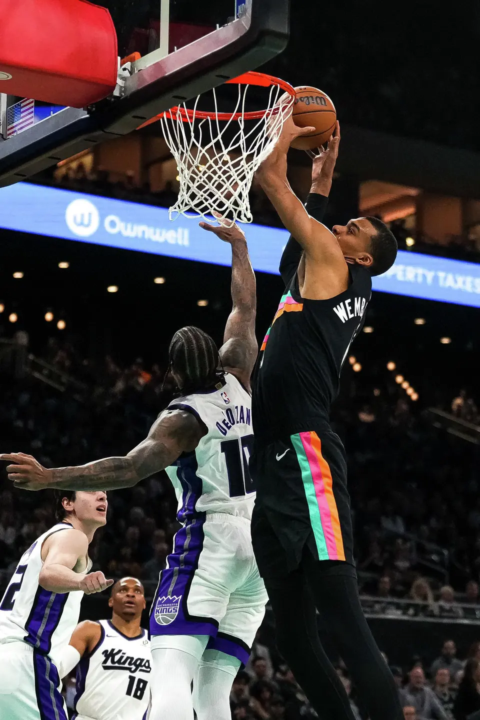 San Antonio Spurs forward Victor Wembanyama (1) dunks the ball over Sacramento Kings guard DeMar DeRozan (10) during the game at the Moody Center on Saturday, Feb. 21, 2026 in Austin.