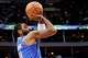 Dallas Mavericks guard Kyrie Irving (11) takes a first half shot against the New Orleans Pelicans at the American Airlines Center in Dallas, January 13, 2024.