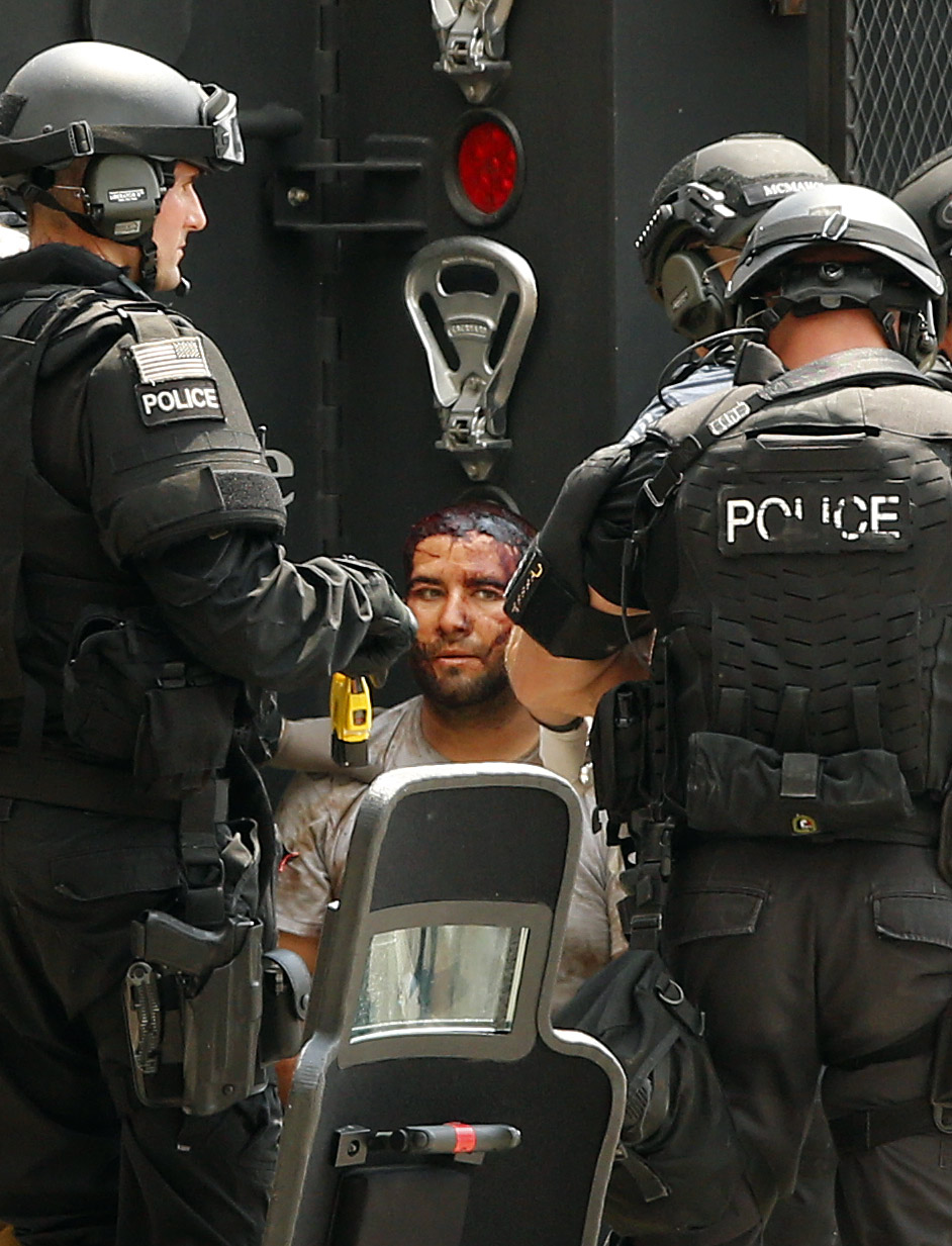 Suspect in custody after police chase with stolen semi ends in standoff ...