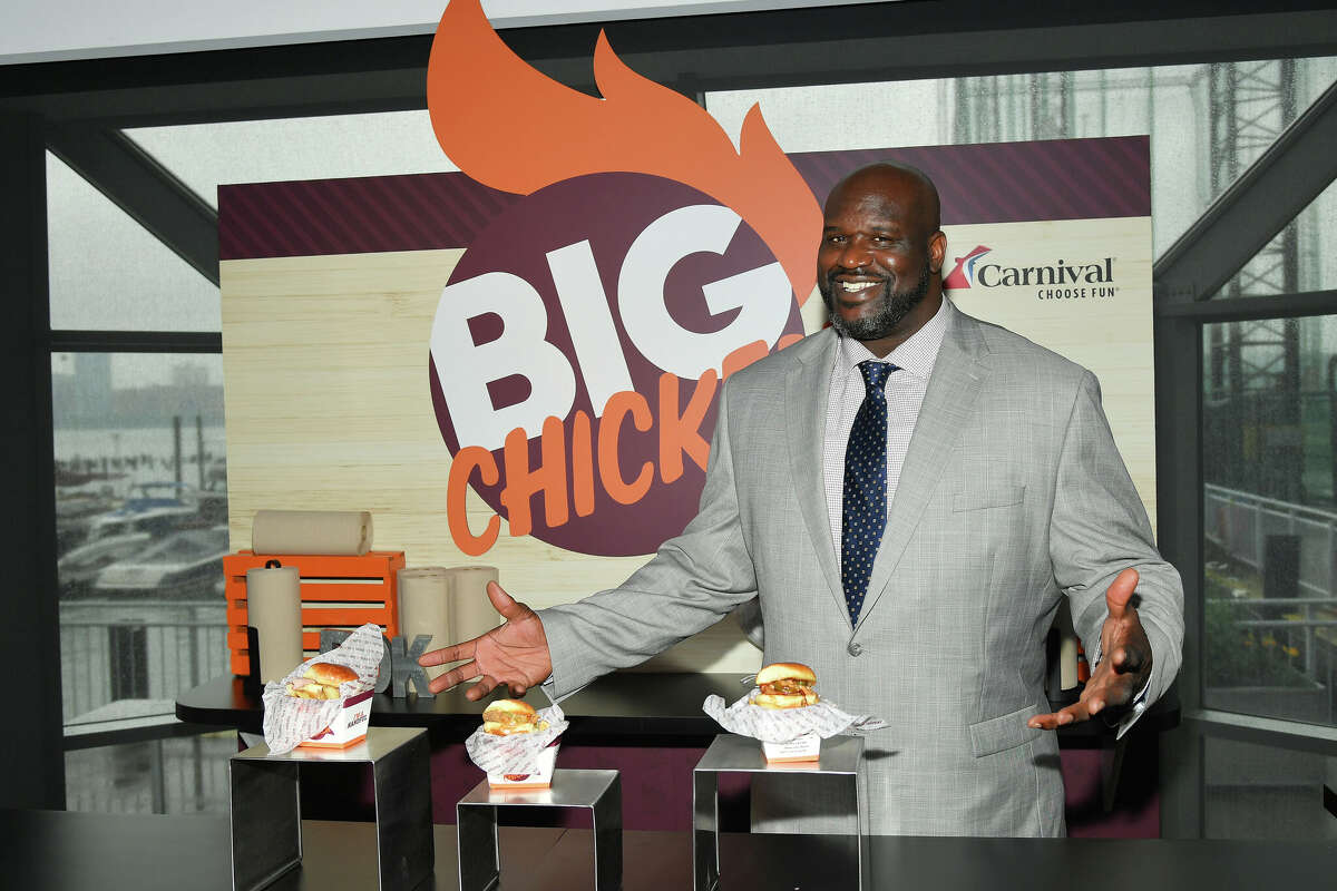 Shaquille O'Neal, NBA star and Carnival Cruise Line's Chief Fun Officer, gives guests a taste of his highly-anticipated dishes that will be offered at sea as part of Big Chicken at Mardi Gras's Summer Landing zone during Carnival Cruise Line's NYC Cruise Into Summer Event To Celebrate The Arrival Of Mardi Gras In 2020 at Pier 59 on June 18, 2019 in New York City.