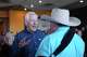 Sen. John Cornyn talks with supporters at a campaign stop in Austin.