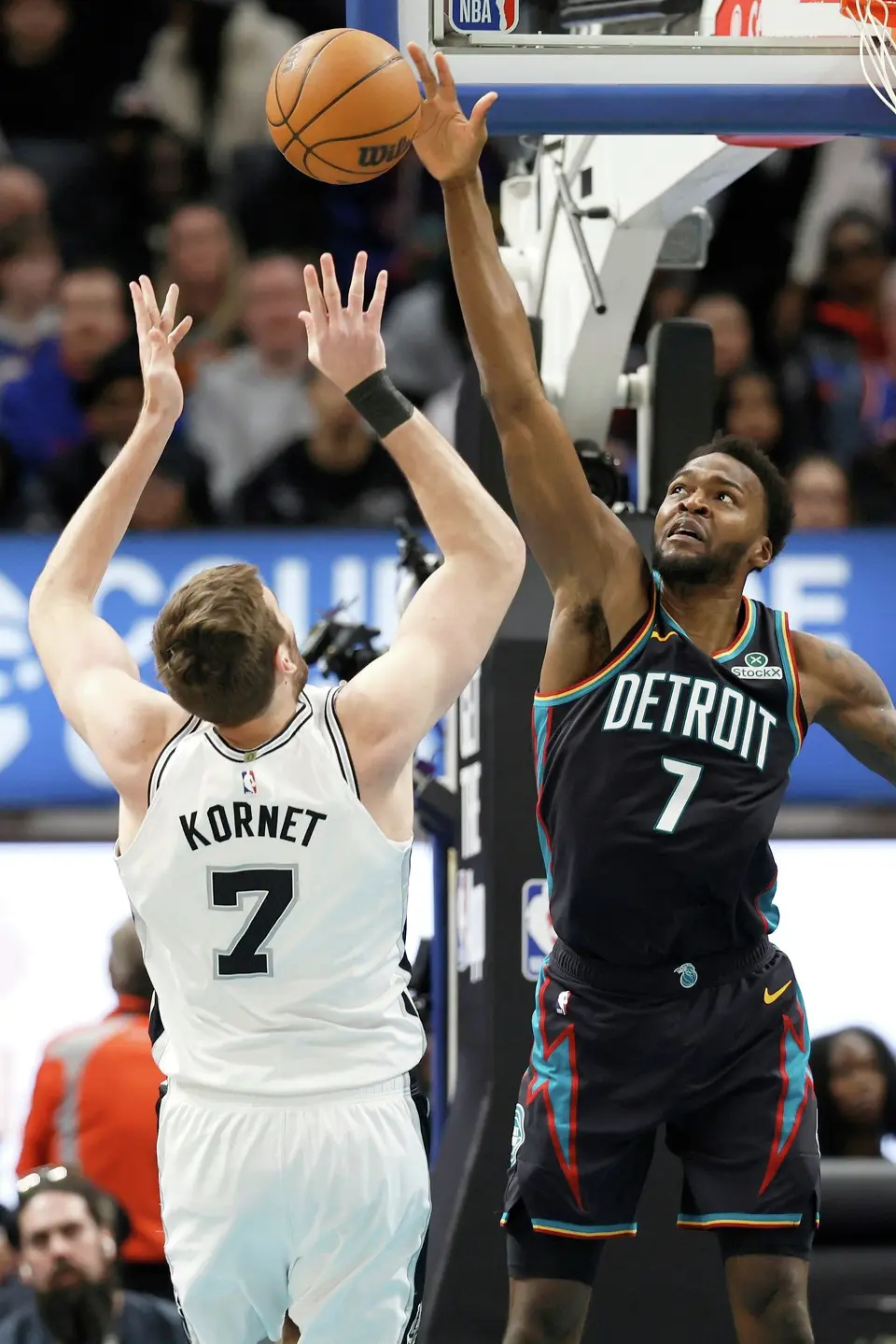 Detroit Pistons forward Paul Reed, right, blocks a shot by San Antonio Spurs center Luke Kornet, left, during the second half of an NBA basketball game Monday, Feb. 23, 2026, in Detroit. (AP Photo/Duane Burleson)