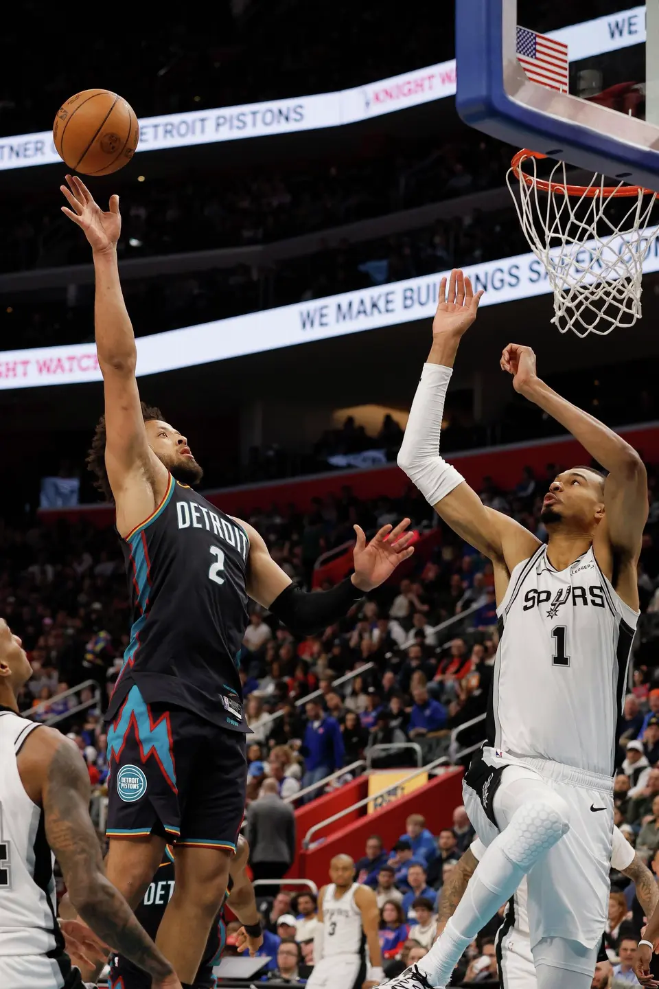 Detroit Pistons guard Cade Cunningham (2) takes a shot against San Antonio Spurs forward Victor Wembanyama (1) during the second half of an NBA basketball game Monday, Feb. 23, 2026, in Detroit. (AP Photo/Duane Burleson)