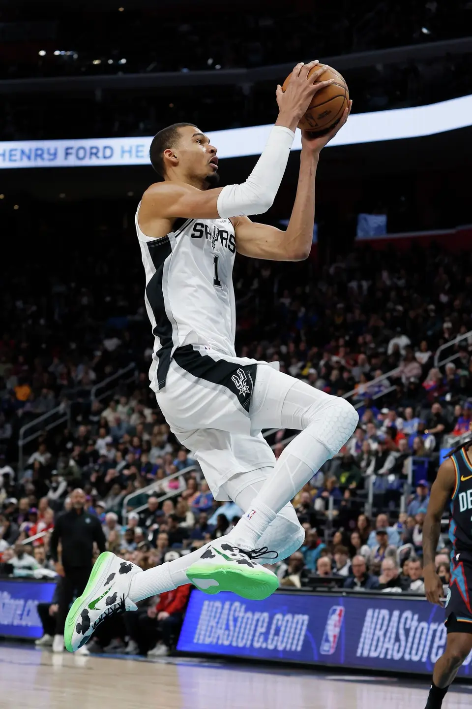 San Antonio Spurs forward Victor Wembanyama (1) goes to the basket against the Detroit Pistons during the first half of an NBA basketball game Monday, Feb. 23, 2026, in Detroit. (AP Photo/Duane Burleson)