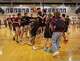Round Rock Dragons swarm the court in celebration of the win against the Lake Travis Cavaliers 67-62 in overtime at the Bi-District Class 6A-Div 1 boys basketball playoff round on Tuesday, Feb 24, 2026, at Eastside Early College High School in Austin, TX.