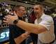 Lake Travis Cavaliers head coach Brandon Shaver receives congratulations from Round Rock Dragons head coach Travis Levie for the 67-62 win at the Bi-District Class 6A-Div 1 boys basketball playoff round on Tuesday, Feb 24, 2026, at Eastside Early College High School in Austin, TX.