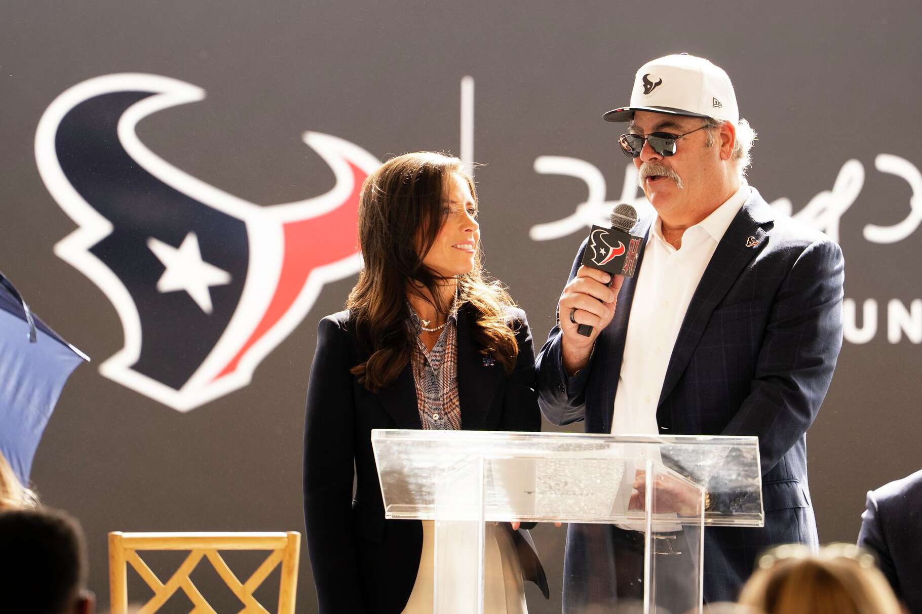 Houston Texans Chair and CEO Cal McNair, right, speaks alongside his wife and Texans Vice President of the Houston Texans Foundation, Hannah McNair, as the Houston Texans announces the development of a new, 83-acre headquarters and practice facility space named the 'Toro District' in the Bridgeland master-planned community in Northwest Harris County in Cypress, Wednesday, Feb. 25, 2026. The project will included a 22-acre headquarters and training complex with plans to open the facility in 2029.
