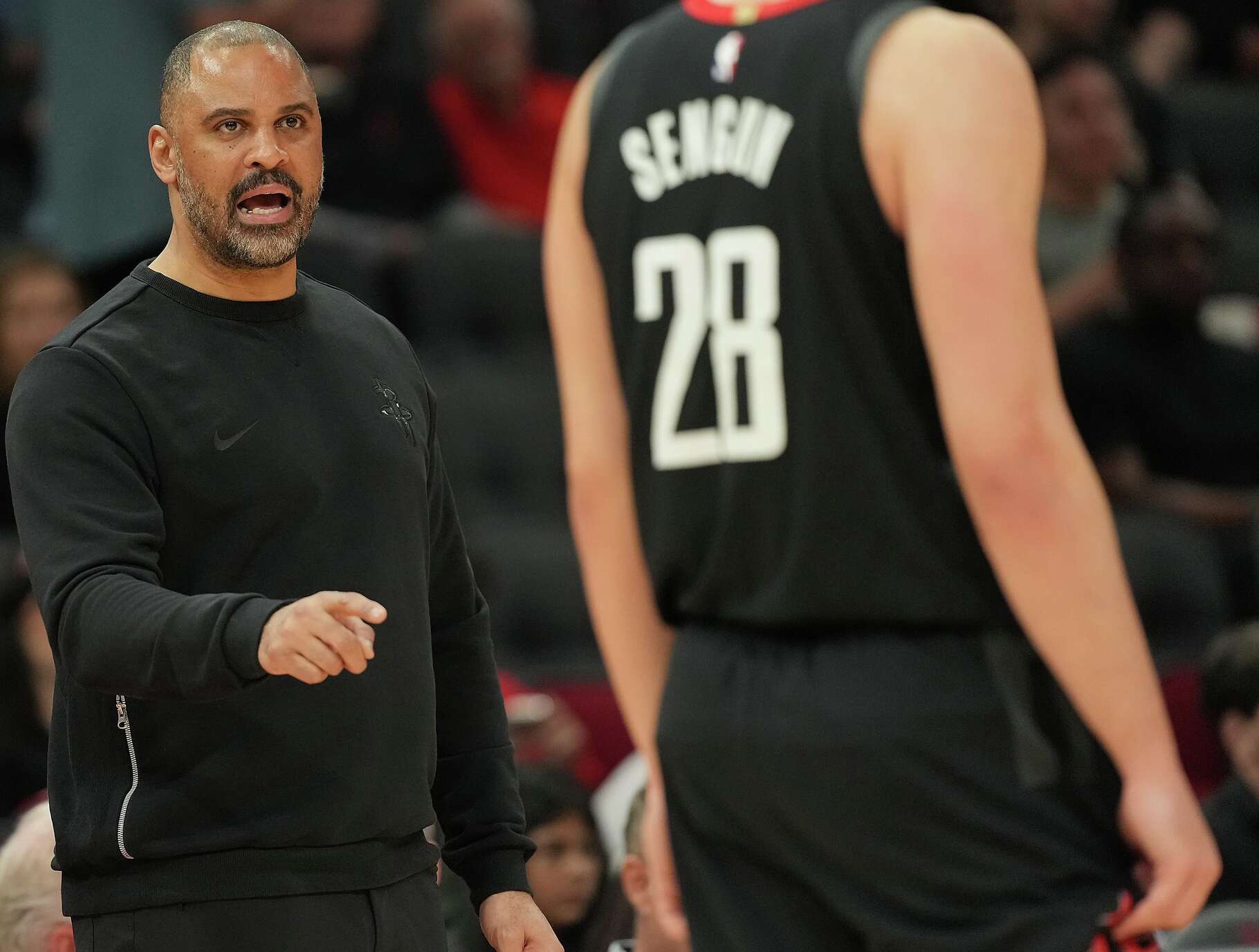 Houston Rockets head coach Ime Udoka talks with Houston Rockets center Alperen Sengun (28) as they take on the Sacramento Kings at the Toyota Center in Houston on Wednesday, Feb. 25, 2026.