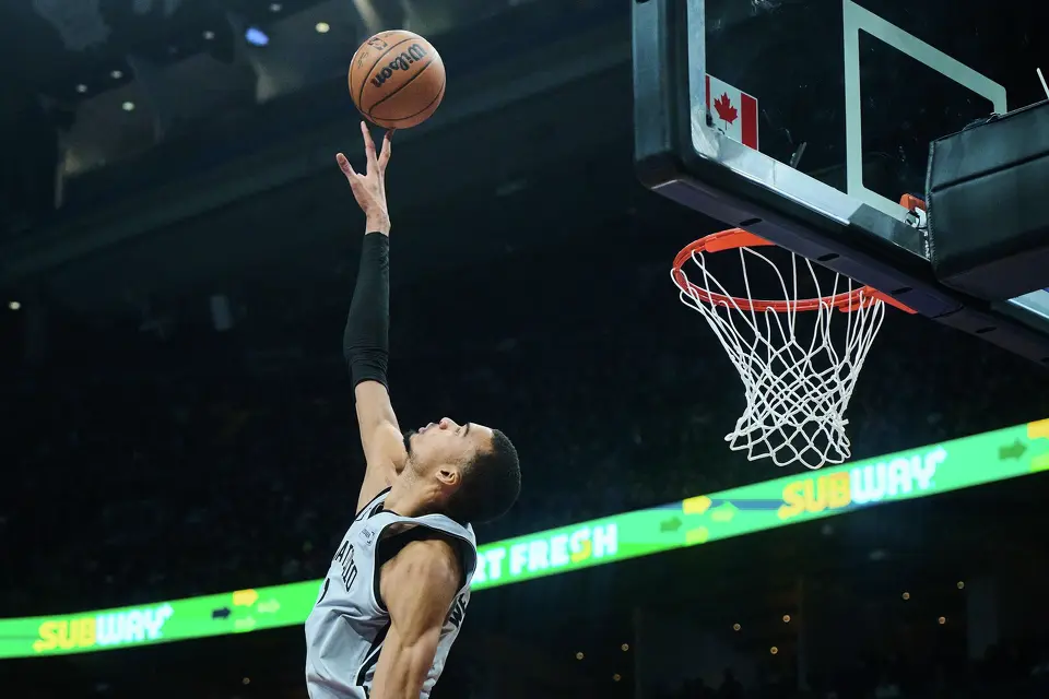 San Antonio Spurs' Victor Wembanyama (1) jumps to block a shot during the first half of an NBA basketball game, against the Toronto Raptors, in Toronto, Wednesday, Feb. 25, 2026. (Sammy Kogan/The Canadian Press via AP)