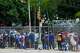 People experiencing homelessness line up for a pop-up food distribution along Cadiz Street on Sunday, July 20, 2025, in Dallas.