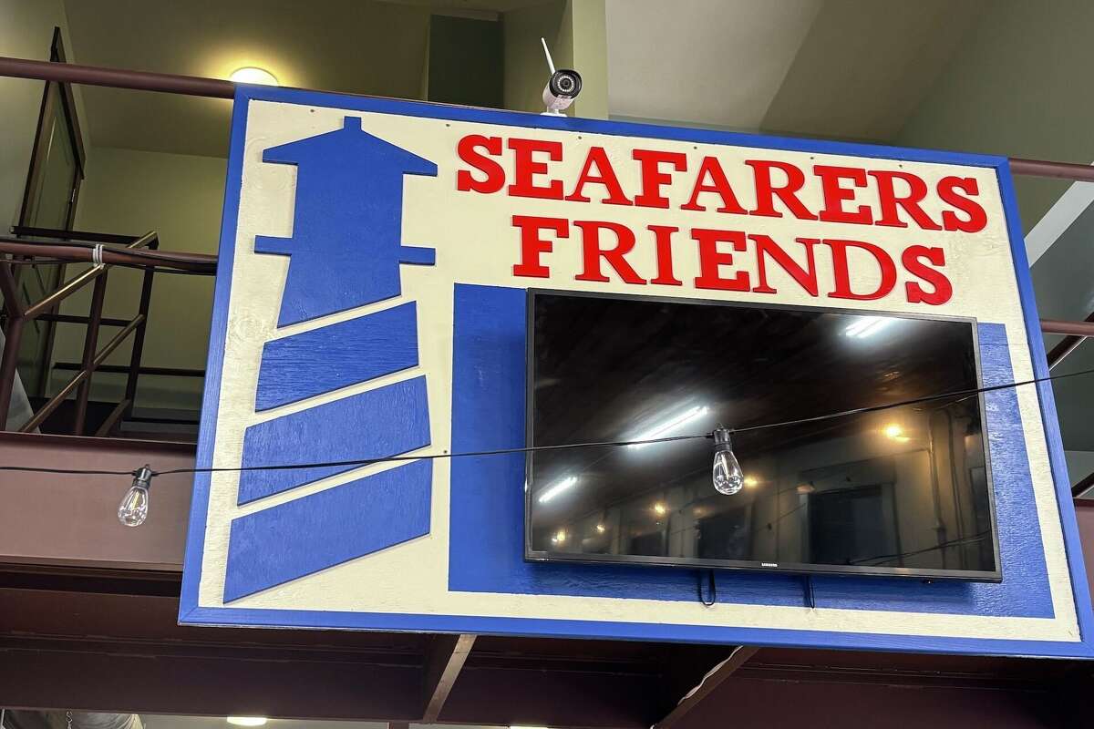 This lighthouse-shaped arrow points the way to the second-floor nondenominational chapel at the Seafarer's Center in Galveston, Texas.