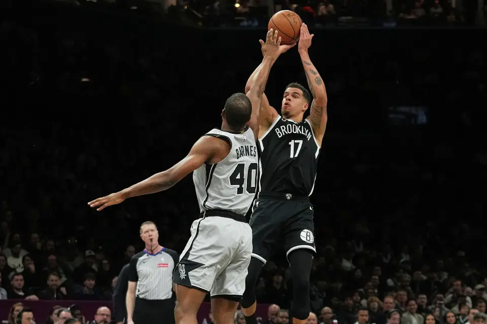 Brooklyn Nets' Michael Porter Jr. (17) shoots over San Antonio Spurs' Harrison Barnes (40) during the first half of an NBA basketball game Thursday, Feb. 26, 2026, in New York. (AP Photo/Frank Franklin II)
