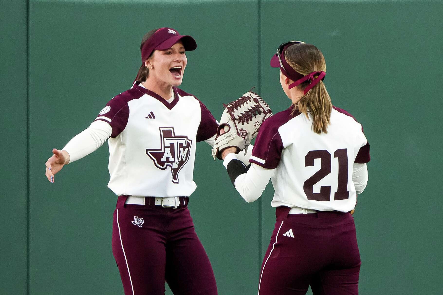 Texas A&M outfielder Kelsey Mathis (99) celebrates a catch for an out by outfielder Scout Lovell (21) during the game against Kennesaw State in the Texas A&M Invitational at Davis Diamond on Friday, February. 27, 2026 in College Station, Texas.