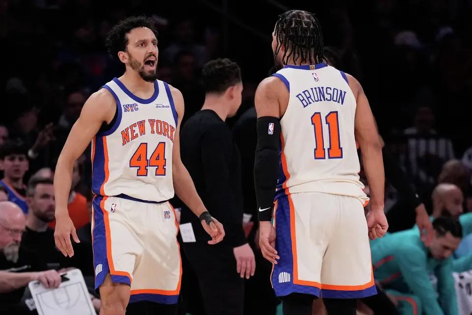 New York Knicks' Landry Shamet, left, celebrates with Jalen Brunson (11) during the second half of an NBA basketball game against the San Antonio Spurs Sunday, March 1, 2026, in New York. (AP Photo/Seth Wenig)