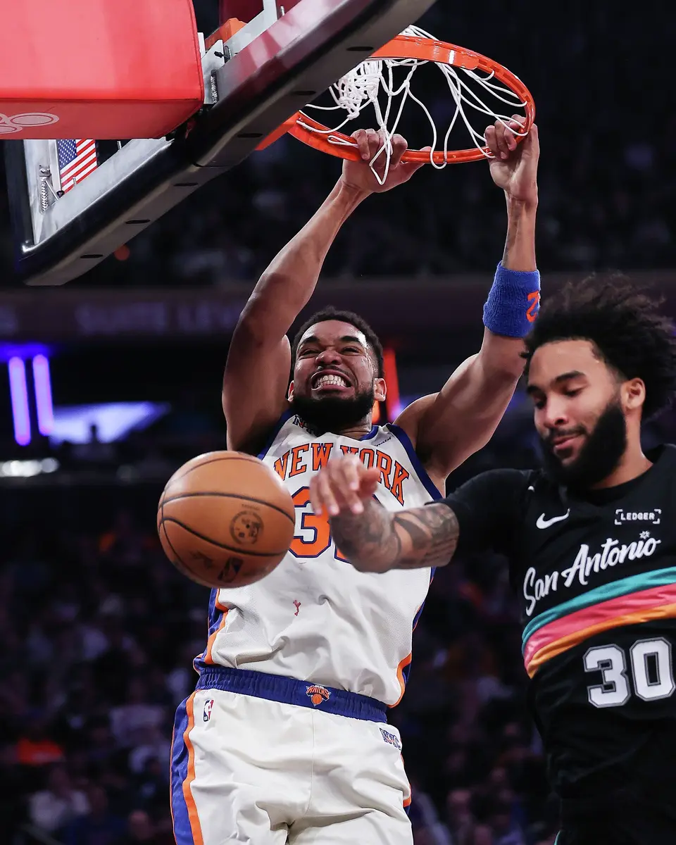 Karl-Anthony Towns (32) of the New York Knicks dunks the ball on Julian Champagnie (30) of the San Antonio Spurs during the first quarter of the game at Madison Square Garden on Sunday, March 1, 2026, in New York City. (Dustin Satloff/Getty Images/TNS)