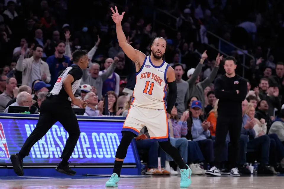 New York Knicks' Jalen Brunson reacts after a three-point basket during the first half of an NBA basketball game against the San Antonio Spurs Sunday, March 1, 2026, in New York. (AP Photo/Seth Wenig)