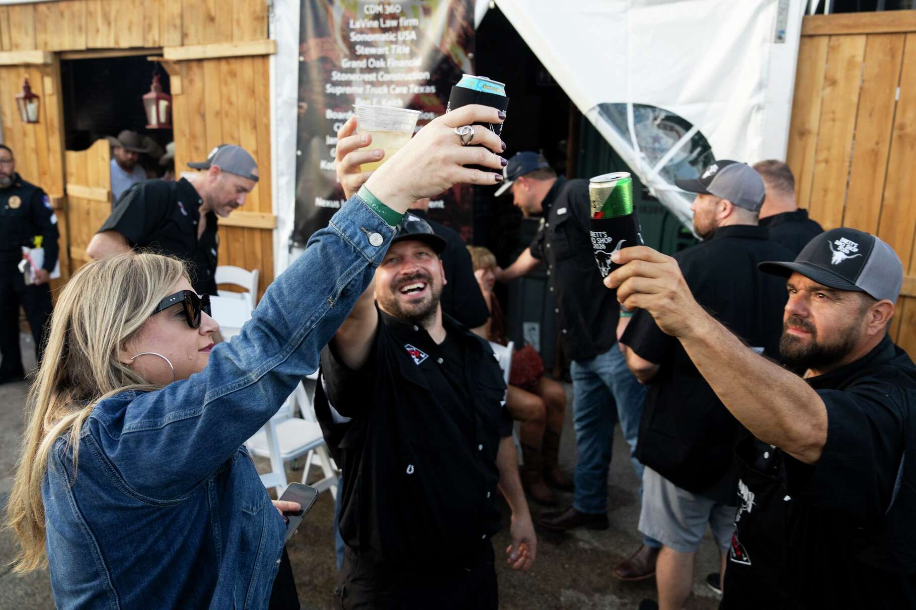 Jacqueline Herrera, left, toasts the team after turning it their final entry during the World's Championship Bar-B-Que at the Houston Livestock Show and Rodeo, Saturday, Feb. 28, 2026.