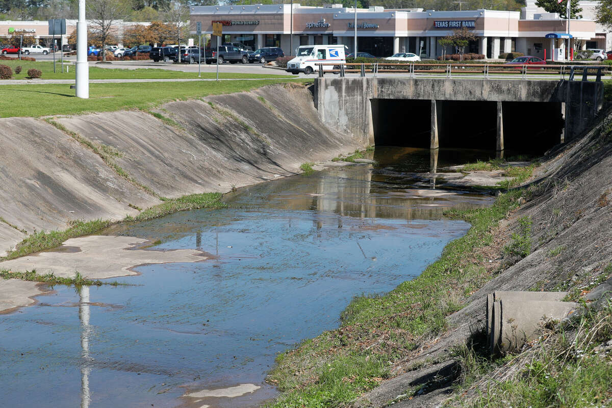 Alligator Creek near Texas 105 toward Frazier Street is seen, Friday, March 26, 2021, in Conroe. The Conroe City Council discussed looking into turning the creek into something similar to The Riverwalk in San Antonio.