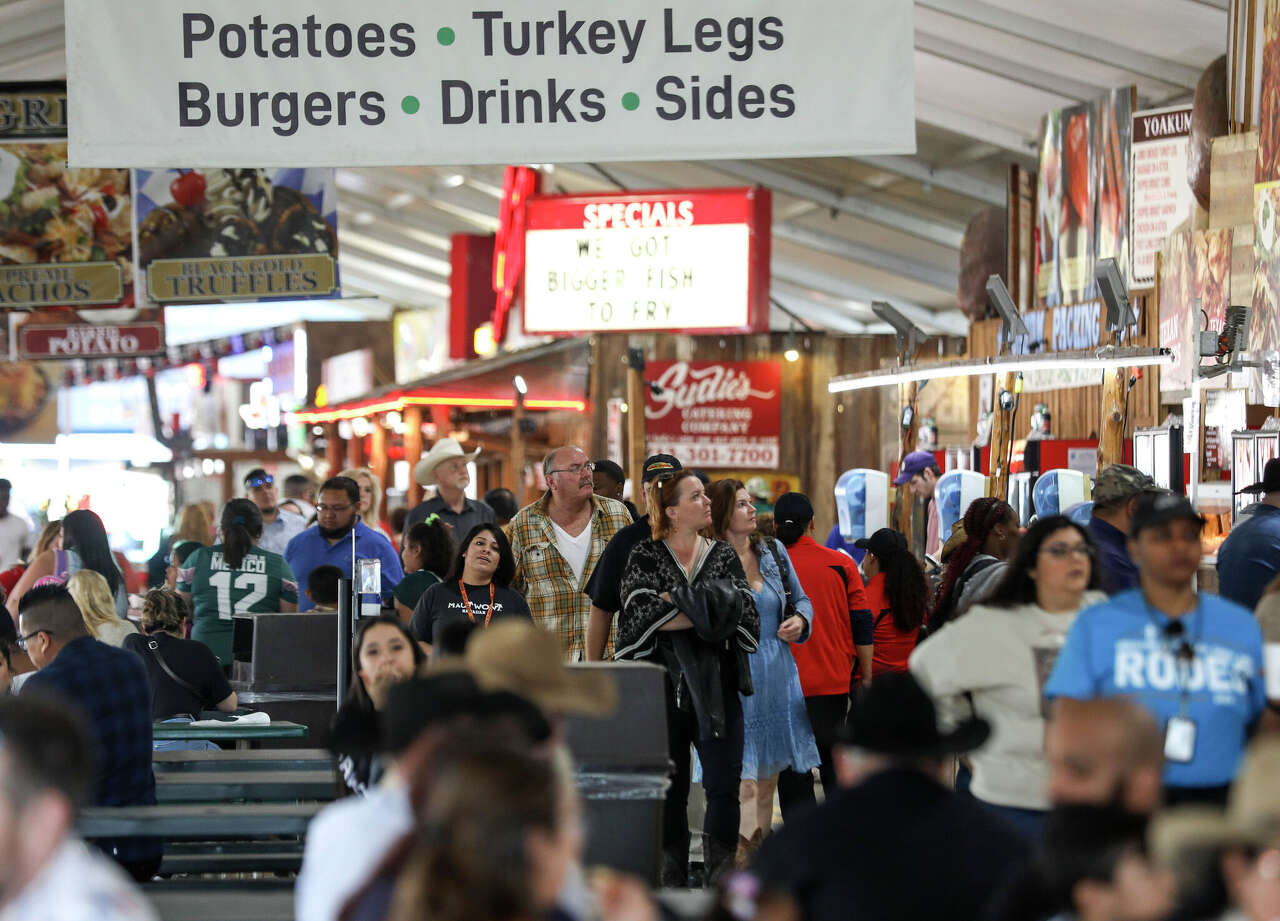 People look for food at the Houston Livestock Show and Rodeo on Thursday, March 5, 2020, at NRG Stadium in Houston.