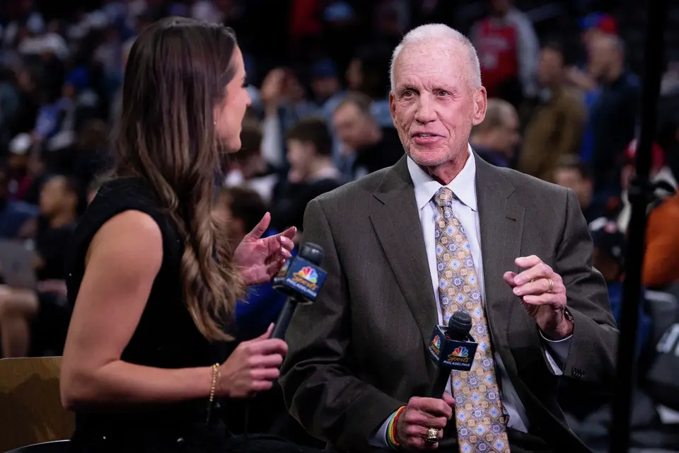 NBC NBA announcer Doug Collins, right, gets interviewed by NBCSports Philadelphia's Ashlyn Sullivan, left, prior to an NBA basketball game between the San Antonio Spurs and the Philadelphia; 76ers, Tuesday, March 3, 2026, in Philadelphia. (AP Photo/Chris Szagola)