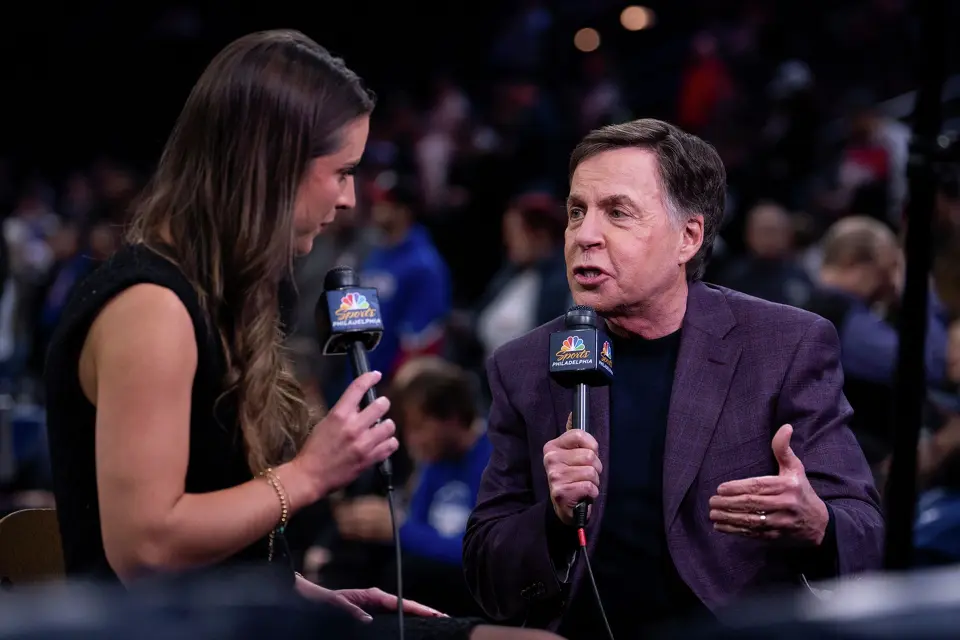NBC NBA announcer Bob Costas, right, gets interviewed by NBCSports Philadelphia's Ashlyn Sullivan, left, prior to an NBA basketball game between the San Antonio Spurs and the Philadelphia; 76ers, Tuesday, March 3, 2026, in Philadelphia. (AP Photo/Chris Szagola)