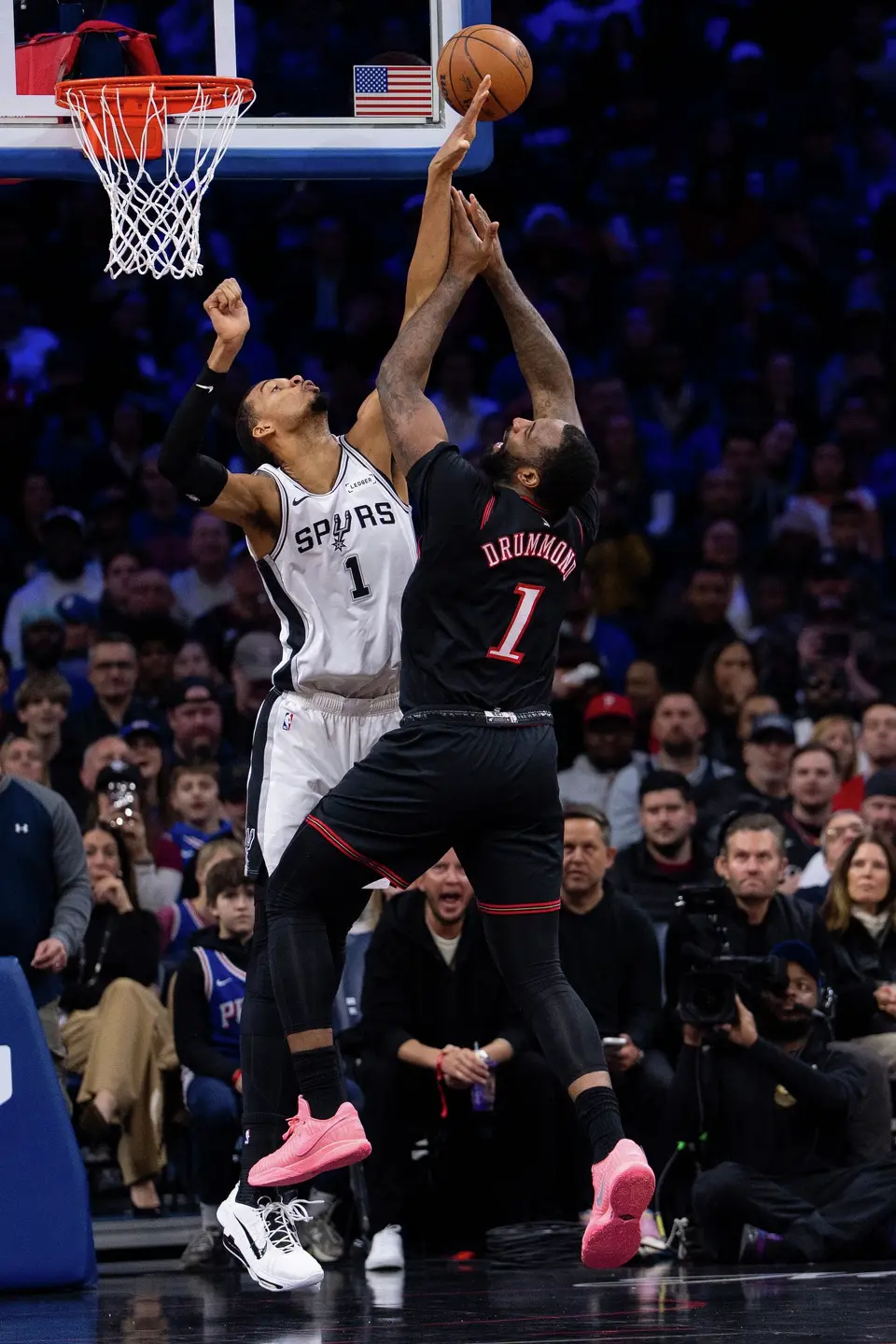 San Antonio Spurs' Victor Wembanyama, left, blocks the shot by Philadelphia 76ers' Andre Drummond during the first half of an NBA basketball game, Tuesday, March 3, 2026, in Philadelphia. (AP Photo/Chris Szagola)