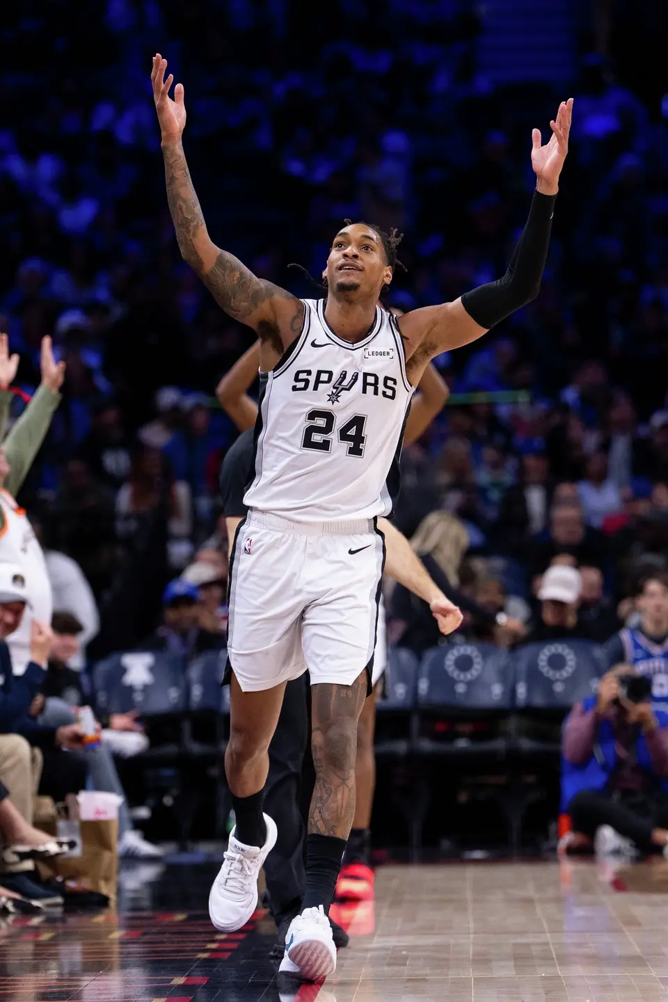 San Antonio Spurs' Devin Vassell reacts to his three-point shot during the second half of an NBA basketball game against the Philadelphia 76ers, Tuesday, March 3, 2026, in Philadelphia. (AP Photo/Chris Szagola)