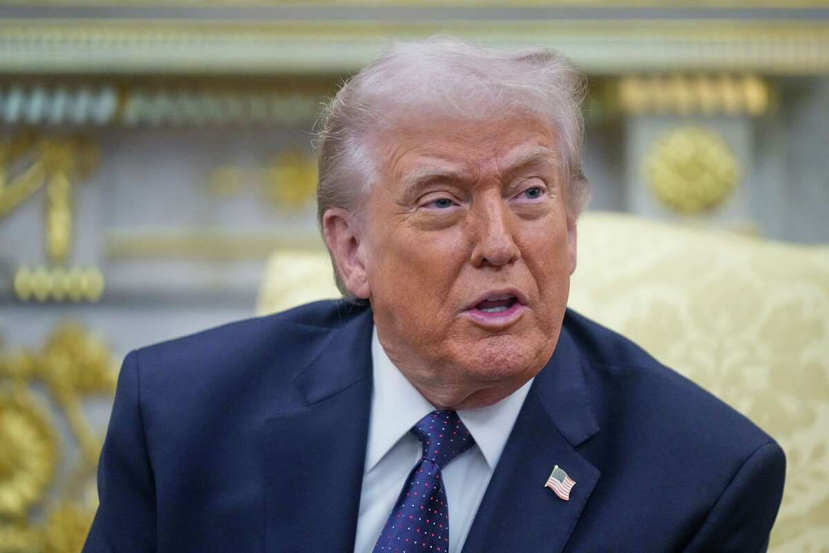 FILE - President Donald Trump speaks during a meeting with German Chancellor Friedrich Merz in the Oval Office at the White House, Tuesday, March 3, 2026, in Washington.