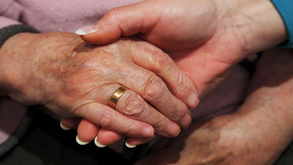 (GERMANY OUT) people, old age, retirement home, Altenzentrum der St. Clemens Hospitale in Sterkrade, a nurse holds the hand of an older woman, close-up, Waltraut, Elke, D-Oberhausen, Ruhr area, Lower Rhine, North Rhine-Westphalia, NRW, D-Oberhausen-Sterkrade (Photo by Werner OTTO/ullstein bild via Getty Images)