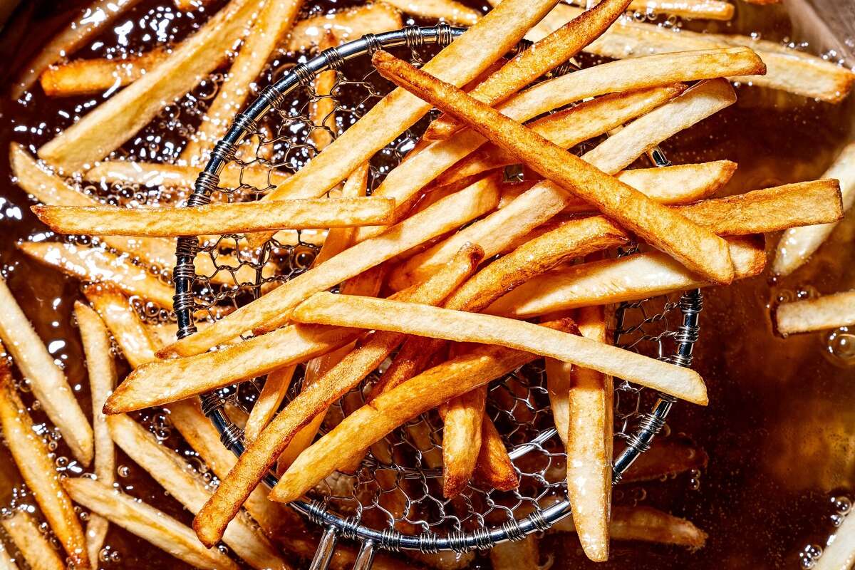 French fries cooking in beef tallow. A popular fast-food restaurant is testing beef tallow for fries in six Corpus Christi, Texas, stores, per a report.