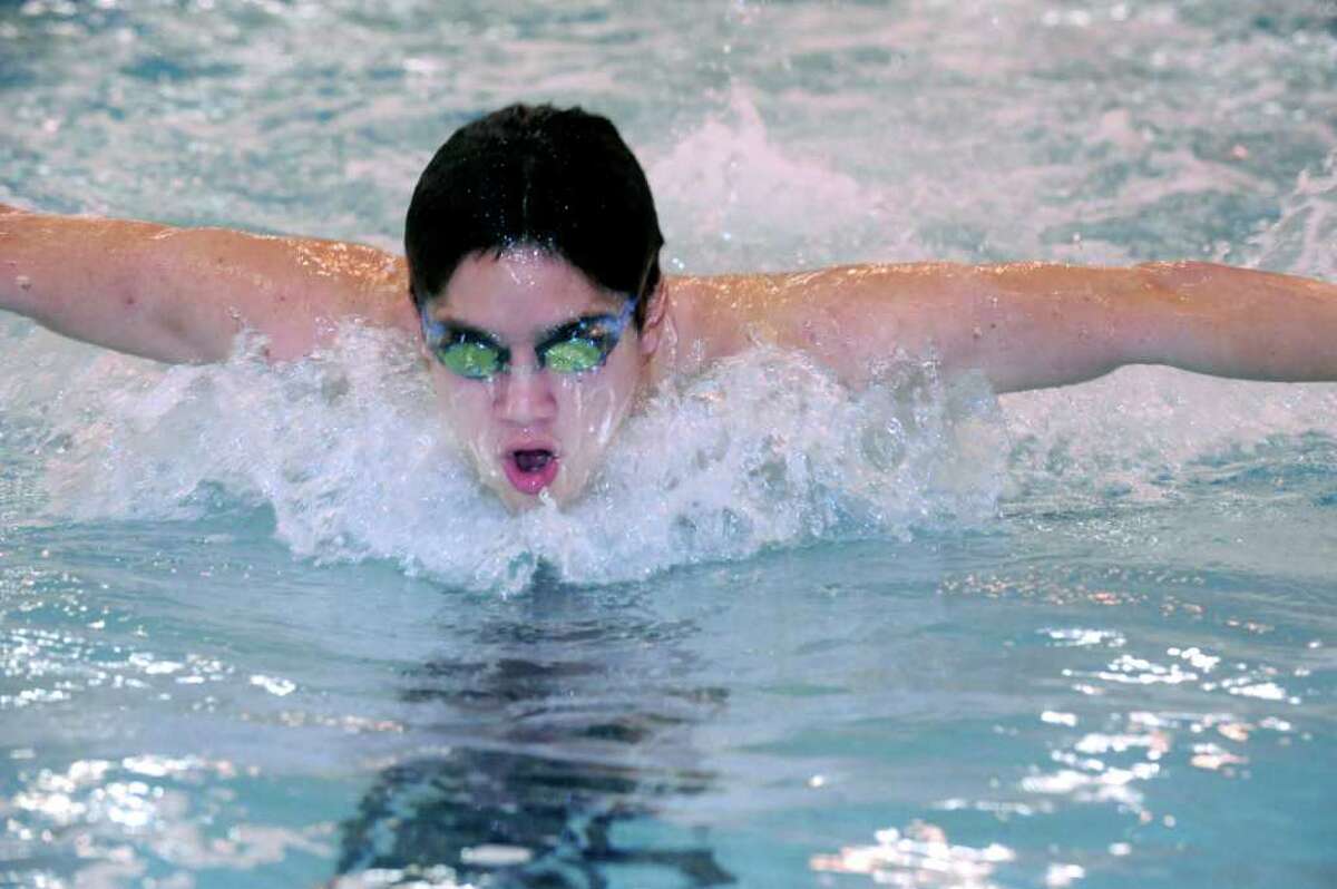 Greenwich High School's co-captain Michael Dustin, a senior, swiming the butterfly stroke in a swim team practice in the school pool on Monday, Dec. 13, 2010.