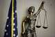 Statue of Lady Justice in a Dallas courtroom.