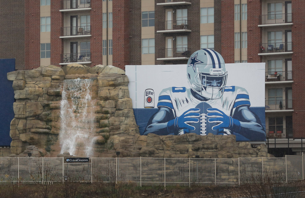 What's the story behind Dallas' famous waterfall billboard? Curious ...