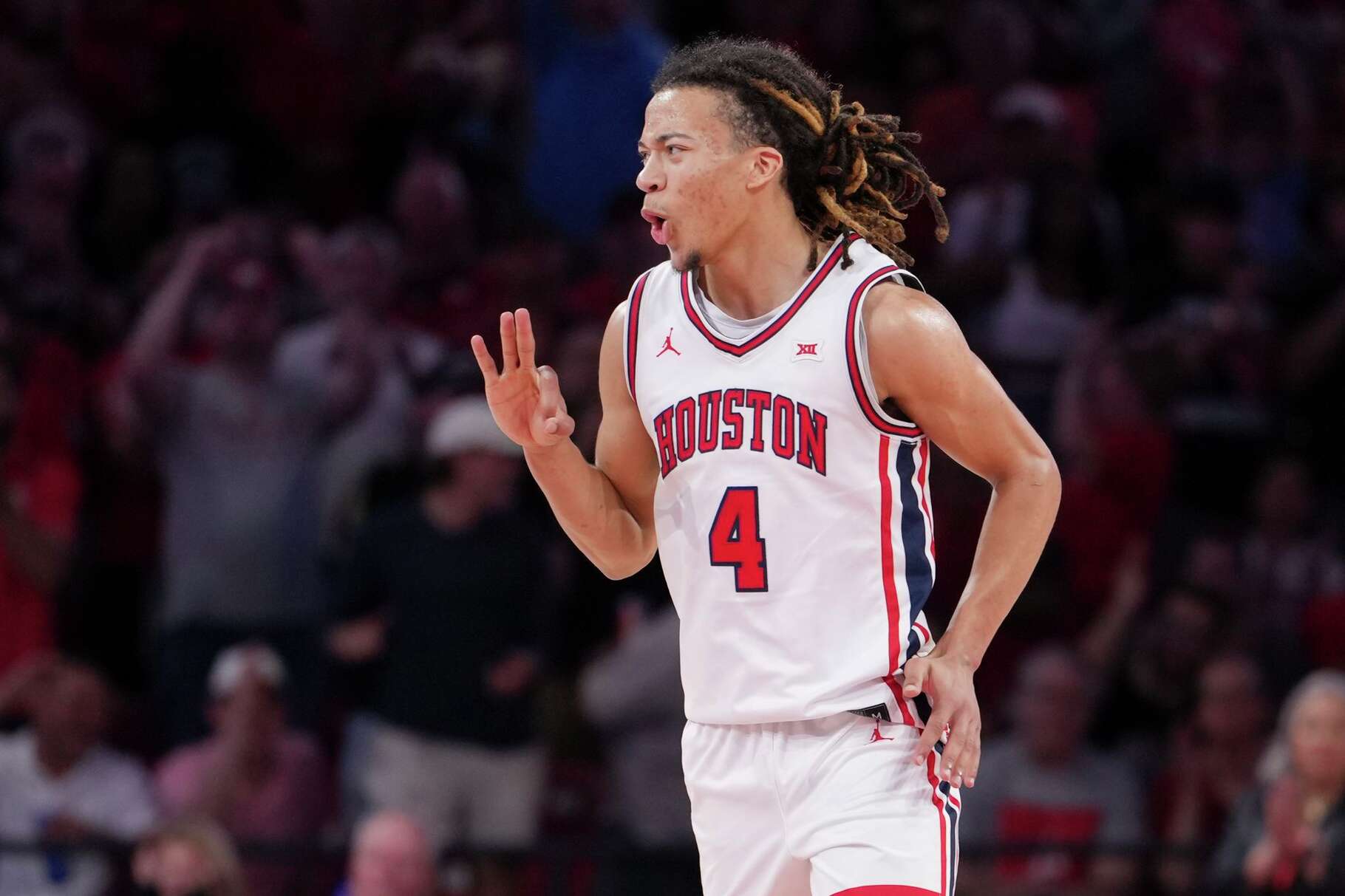 Houston Cougars guard Kingston Flemings (4) reacts after hitting a 3-pointer during the second half a NCAA college basketball game in Houston, Wednesday, March 4, 2026.